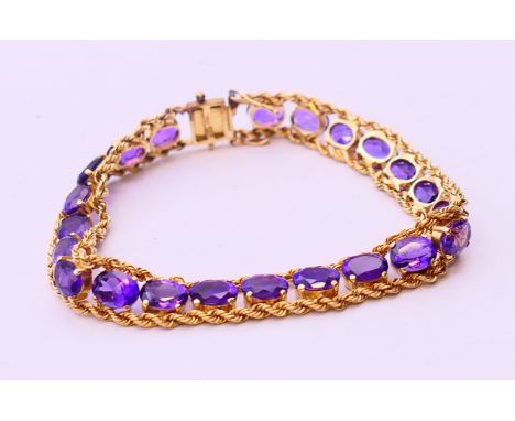 A 14 K gold amethyst bracelet. 18 cm long. 15.7 grammes total weight. 