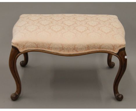 An upholstered stool. 45 cm high.