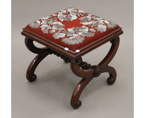 A Victorian beadwork stool. 48 cm wide.
