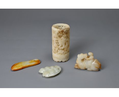 FOUR CHINESE CARVED JADE ITEMS. To include a cylindrical pot carved and pierced with figures of cranes; A carving of a man se