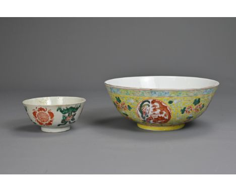 TWO CHINESE PORCELAIN BOWLS, LATE 19TH CENTURY. To include a yellow ground bowl decorated with dragon and phoenix roundels, w