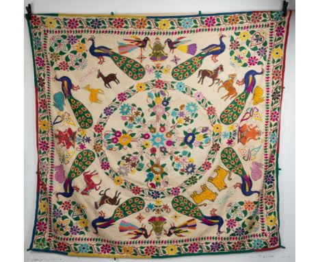 A VINTAGE INDIAN (GUJARATI) EMBROIDERED WALL HANGING. Decorated with rabbits, peacocks, horses, butterflies, Ganesh and deiti