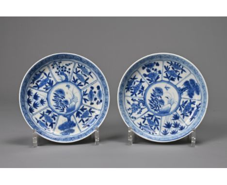 A PAIR OF CHINESE BLUE AND WHITE PORCELAIN DISHES, 18TH CENTURY. Finely potted, decorated with panels of seasonal flowers. Ea