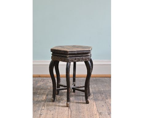 CHINESE BLACK LACQUER HEXAGONAL OCCASIONAL TABLE, 20th Century, with a carved key pattern frieze, serpentine legs and stylise