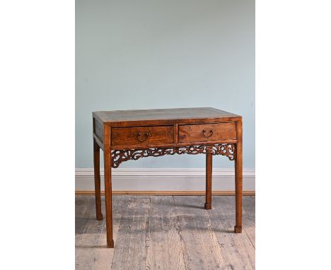 CHINESE ELM TWO DRAWER CONSOLE TABLE, 20TH CENTURY, with metal handles and a pierced apron, raised on tapered legs and stylis