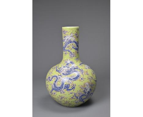 A CHINESE LIME GREEN GROUND TIANQIUPING, KANGXI MARK, 20TH CENTURY. Globular body leading into a tall cylindrical neck decora