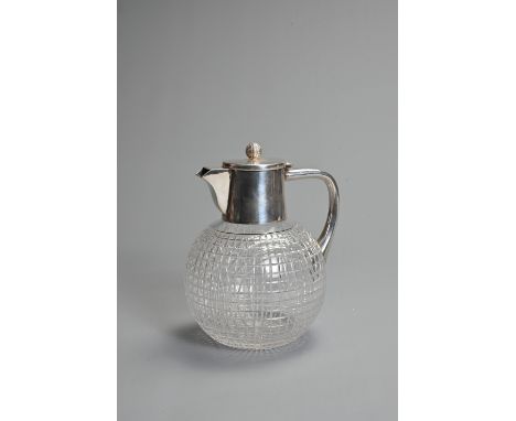 AN EDWARDIAN SILVER-PLATED CUT-GLASS 'GOLF BALL' CLARET JUG. With silver-plate golf ball finial, the globular body cut with l