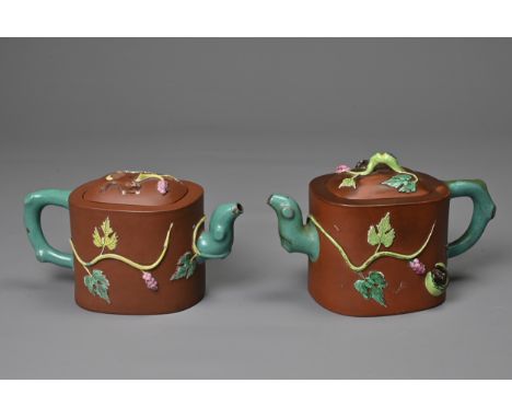 A PAIR OF VINTAGE CHINESE YIXING POTTERY TEAPOTS, 20TH CENTURY. Each with added enamelled grape vine and squirrels with turqu