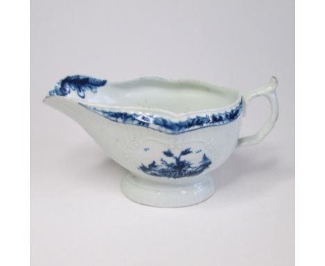 A Worcester blue and white Sauce boat of pleated and moulded form, painted with two Chinese landscapes in moulded panels, cir