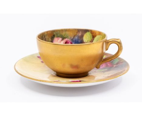 A matched Royal Worcester coffee cup and saucer,  the interior cup and saucers painted with pink roses and signed by W H Aust