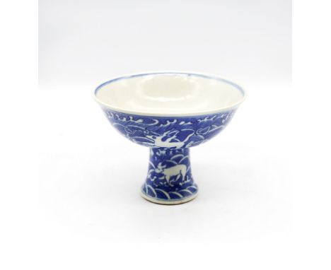 A Chinese blue and white Stem cup decorated with mythical beasts, six character marks of Kangxi inside bowl, approx 10cm high