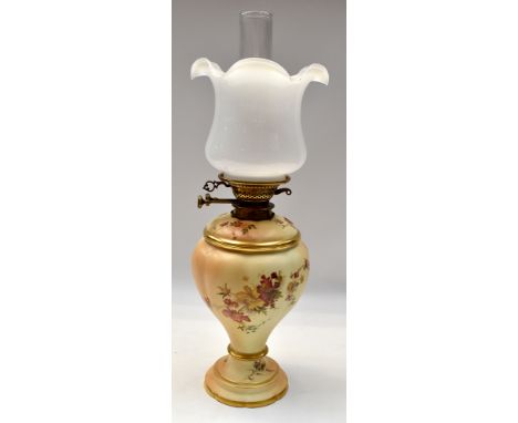 A Royal Worcester ceramic oil lamp base, with a removable cover, both cover and base have hand painted floral designs, marked