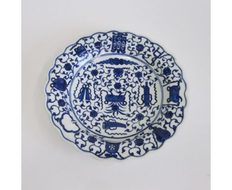 A Worcester dessert plate, of lobed circular shape and painted in blue with the 'Hundred Antiques' pattern, unique and unusua