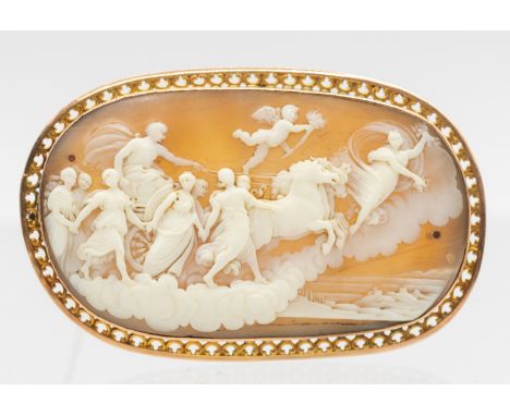 A 19th century finely carved 9ct gold mounted cameo brooch, carved to depict Phoebus Apollo, the god of the sun, taking the s