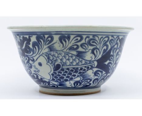 A Chinese heavy blue and white fish bowl, decoration of fish swimming amongst water weeds, height approx. 10cm, width approx.