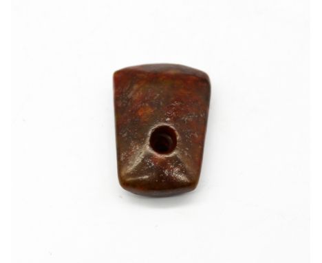 A Neolithic carved polished stone axe head, approx 3000-2000 BC