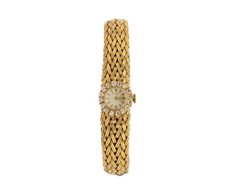 Bueche-Girod: a Ladies 9ct gold wristwatch, comprising a round signed silvered dial with gold baton indices, the bezel diamon