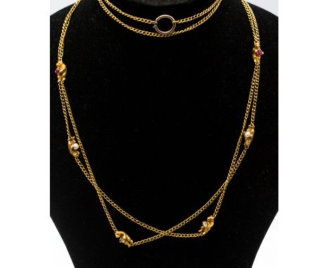 An early 20th century fancy guard gold stone set chain, comprising eight carved bears holding various round mixed cut stones 