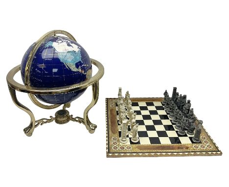 Polished hardstone terrestrial globe, together with chess board and part set of chess pieces, globe H50cm