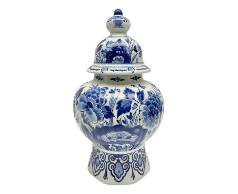 De Porceleyne Fles Delftware blue and white covered jar, of fluted baluster form, with floral and insect decoration, upon an 