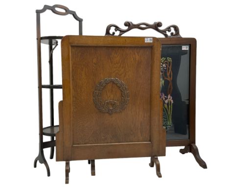 Early 20th century mahogany framed fire screen with needlework panel (W64cm); early 20th century oak fire screen (W57cm); and