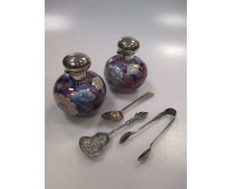A pair of silver capped scent bottles (one badly damaged), a Continental silver caddy-type shovel spoon, another etc  