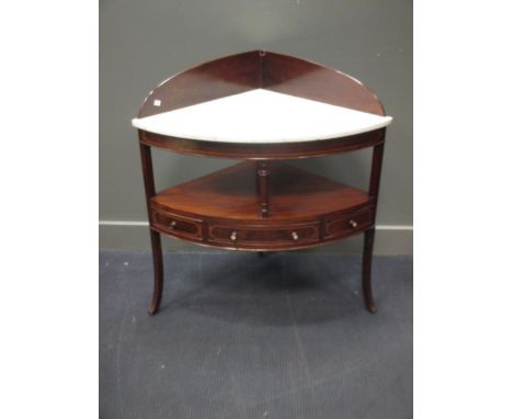 A mahogany bow front corner wash stand with marble top  