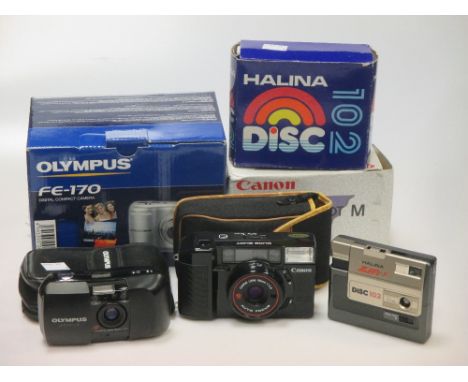 A Halina 'Zippy F' Disc 102 camera, boxed, a Canon 'Sure Shot' instamatic camera, cased, an Olympus compact camera and an Oly
