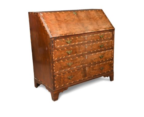 A George III mahogany bureau, inlaid with boxwood and crossbanded in olivewood to the fall and four drawer fronts, repeated t