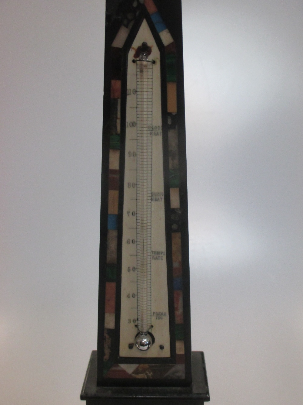 An Ashford marble obelisk set with a thermometer and two other stone ...