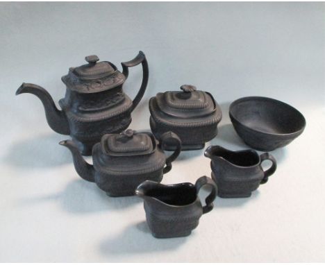 A Hartley Green &amp; Co Leeds black basalt six piece black basalt tea service, each piece moulded with strawberries within g