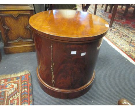 A 19th century flame mahogany cylindrical commode  