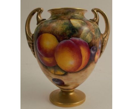 A Royal Worcester pedestal vase, decorated to the front with fruit to a mossy background by R Lynes, with gilt handles and fo