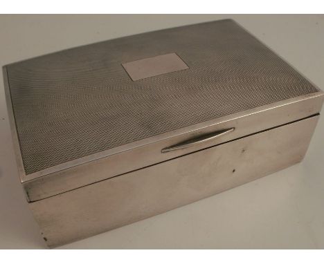 A silver cigarette box, with engine turning to the top, Birmingham 1913, 5.5ins x 3.5ins, height 1.75ins