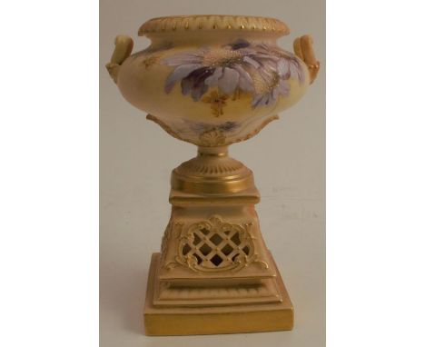 A Royal Worcester blush ivory urn shaped vase, on pierced pedestal, decorated with blue flowers, shape number 1949, dated 189