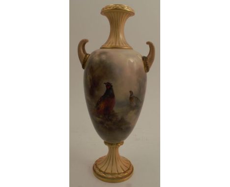 A Royal Worcester pedestal vase, with blush ivory neck, handles and foot, the body decorated all around with pheasants in lan