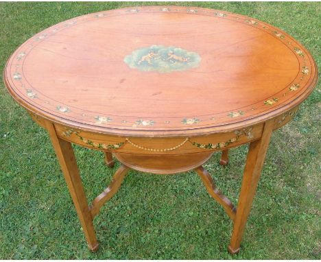 An Edwardian satinwood oval occasional table, decorated to the top and frieze with putti and flowers, raised on four square t