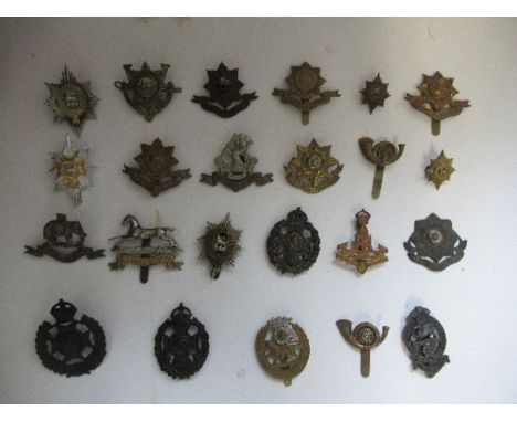 A quantity of British infantry military badges, to include Princess of Wales's Royal Regiment, West Yorkshire, Worcester Roya