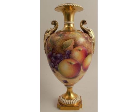 A Royal Worcester vase, raised on a plinth, decorated all around with hand painted fruit by Hughes, shape number 1969, height