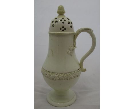 An 18th century Leeds creamware sugar caster, of baluster form, with acorn finial, scroll handle, band of leaf decoration to 