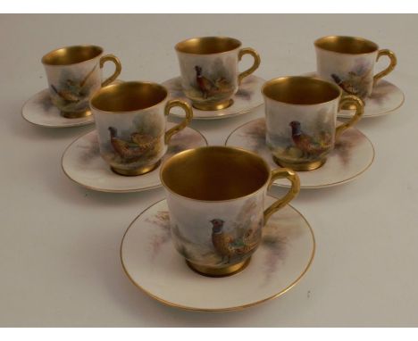 A set of six Royal Worcester coffee cups and saucers, decorated with pheasants in landscape by Jas Stinton, dated 1918 no obv