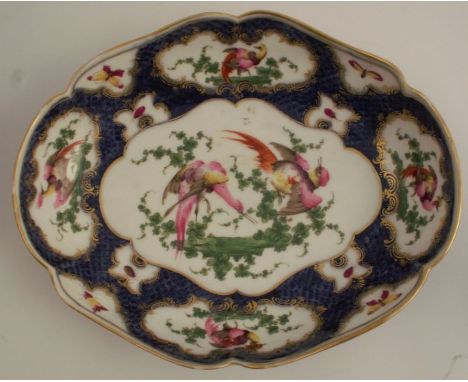 A 19th century Samson of Paris porcelain shaped oval dish, decorated with reserves of fabulous birds to a scale blue ground, 