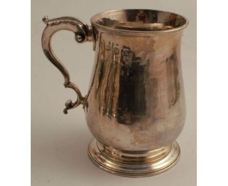 An 18th century silver mug, of baluster form, London 1783, weight 12oz, height 5.25ins - thin patch by handle, handle has bee