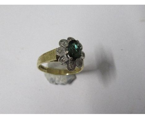 An 18 carat gold green tourmaline and diamond cluster ring, finger size K, 3.9g gross