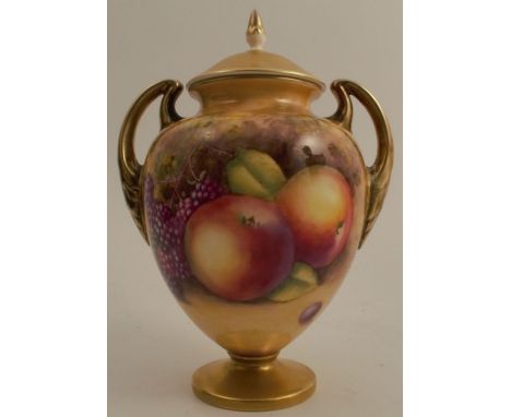 A Royal Worcester covered pedestal vase, decorated all around with fruit to a mossy background by Nutt, shape number 2701 s/s