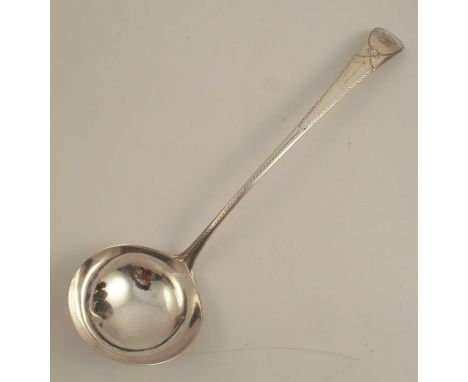 An 18th century silver ladle, with bright cut decoration to the handle and a Heron under script "NE OUBLIE", London 1784