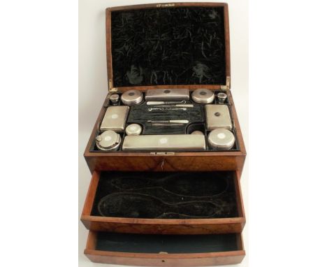 A 19th century walnut dressing table box, the hinged lid opening to reveal a fitted lift out tray, fitted with various hallma