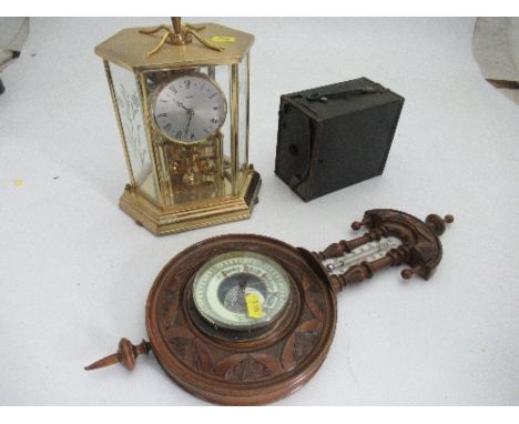 A Kundo hexagonal shaped clock, with ball movement, together with an oak cased barometer and a Kodak box camera