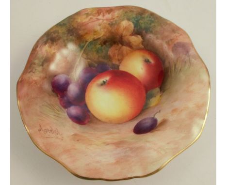 A Royal Worcester dish, with frilled edge, decorated with fruit to a mossy background by Moseley, raised on a pedestal foot, 