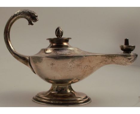 A silver Aladdin's lamp oil lamp, with mask to the handle, raised on an oval pedestal foot, Birmingham 1919, weight 2oz